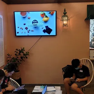 a group of people sitting around a table