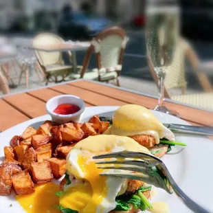 Crab Cake Eggs Benedict; a glass of Cava.