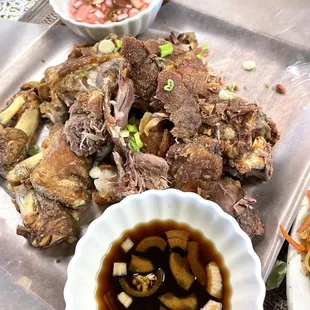 a plate of food and a bowl of sauce