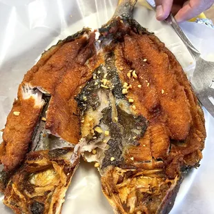a plate of fried fish
