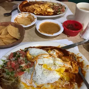 2 eggs(scrambled plate and over easy) on top of 2 enchiladas. Ole!