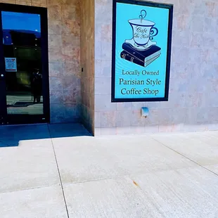 the entrance to a coffee shop