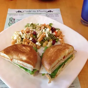 Sandwich au Soleil: turkey, cream cheese, tomato spread, lettuce, alfalfa, on bagel; with pasta salad