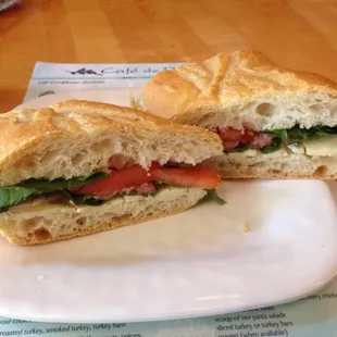 Sandwich at Fromage: Brie cheese w/lettuce, tomato, alfalfa, baguette.