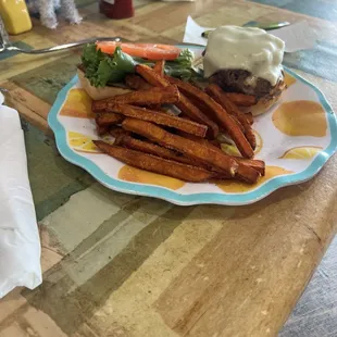 This is the burger with cheese, mushroom, and bacon bits