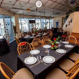a dining room with tables and chairs