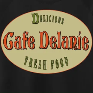 a black t - shirt with the words delicious cafe delanie