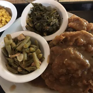 Smothered Pork Chop &amp; Chicken with Collared Greens, Green Beans, Corn, and a Cornbread Muffin.