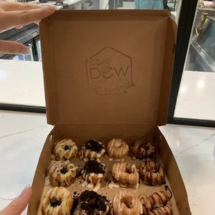 12 Tiny Mini doughnuts Left to right- lemon blueberry, cookies and cream, fluffed nutter, PB and chocolate