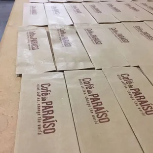 Stamping our sample bags.  Sample bags are a great way to try our some of our many different coffees.  Each has a different unique flavor!