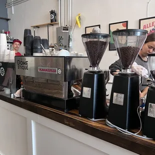 coffee grinders lined up on a counter