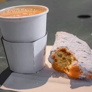 a pastry and a cup of coffee