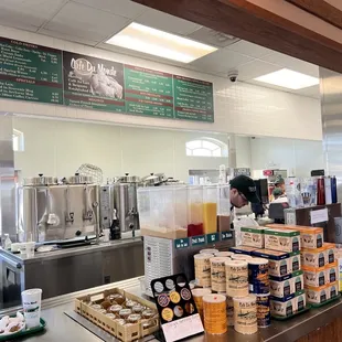 a woman working behind the counter