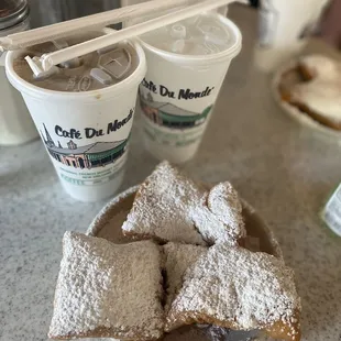 Iced cafe au lait with beignets