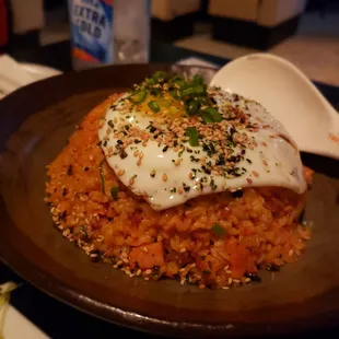 a fried egg on a bed of rice
