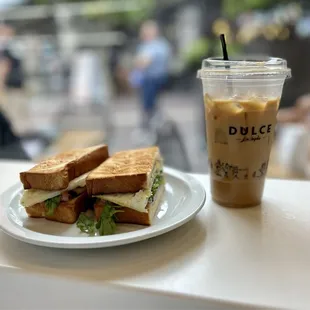 Breakfast sandwich and iced oat milk latte.