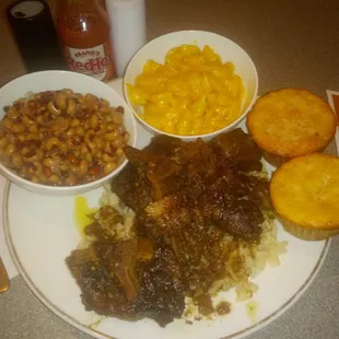 Oxtails over rice W/Black eye P's &amp; Mac