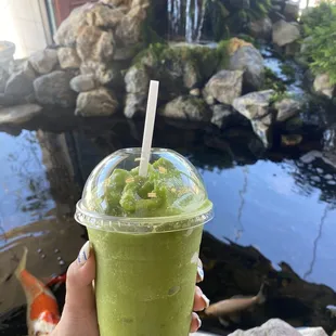 Green machine smoothie: oj, mango, kale, spinach, ginger