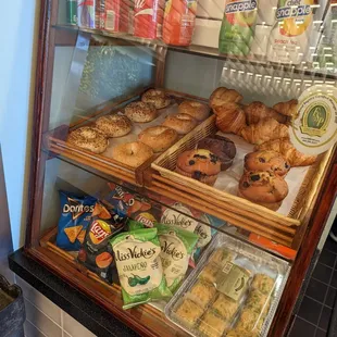 a display case filled with pastries