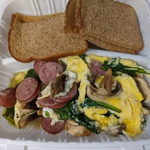 Omelette with sausage, spinach, and mushrooms