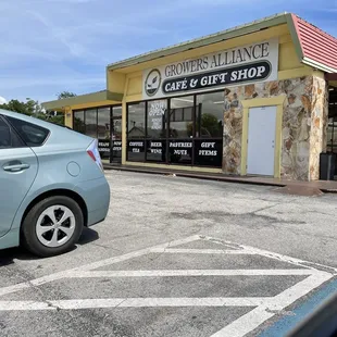 a car parked in front of a restaurant