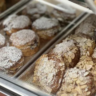 a variety of pastries in a display case