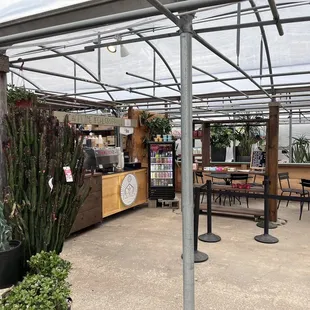 a patio with tables and chairs