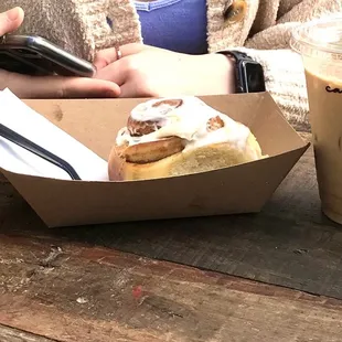 A yummy caramel latte and soft delicious cinnamon roll, also try their spice brown sugar latte !