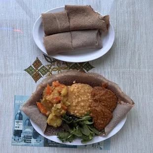 Vegetarian combo (also is vegan) with personal three choices of ater, alecha ater, and atakelt kilkil. Injera is included with the order