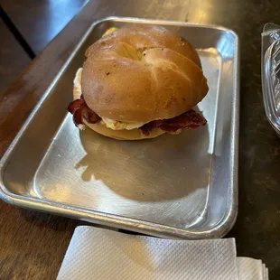 Bacon, egg, American &amp; cream cheese bagel sandwich