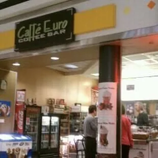 the entrance to a coffee shop