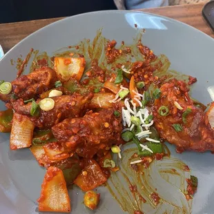 Momo&apos;s tossed in chili chicken sauce