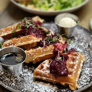 Waffles &amp; berries, ceasar salad with salmon in the back