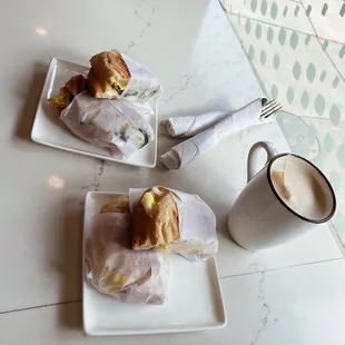 two plates of food and a cup of coffee