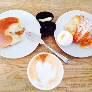 two plates of pastries and a cup of coffee