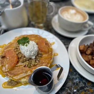 Passion fruit pancakes with a side of potatoes