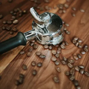 coffee beans scattered on a wooden table