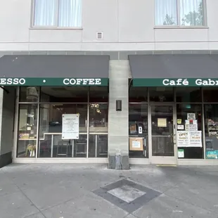 the entrance to a coffee shop