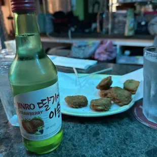 Strawberry soju and chicken nuggets