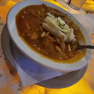 a bowl of chili and cheese