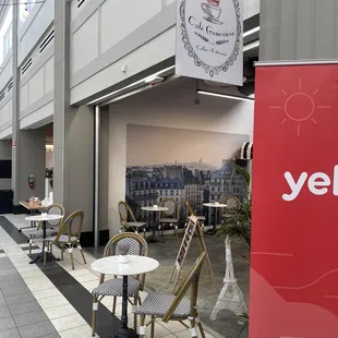tables and chairs in a shopping mall