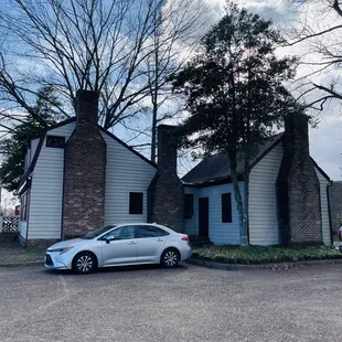 a car parked in front of a building