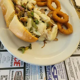 a sandwich and onion rings