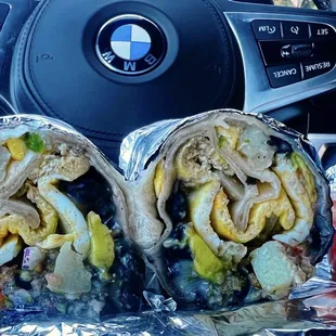 Sausage breakfast burrito w/ two eggs, potatoes, cheese, black beans, avocado, salsa | $10.95 (sorry for the bad pic!)