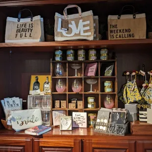 a display of various items on a wooden shelf