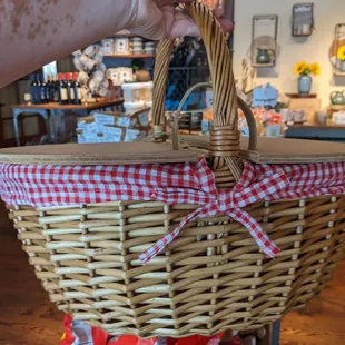 a person holding a wicker basket