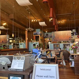customers sitting at tables in a restaurant