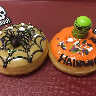 two spooky donuts with spooky decorations