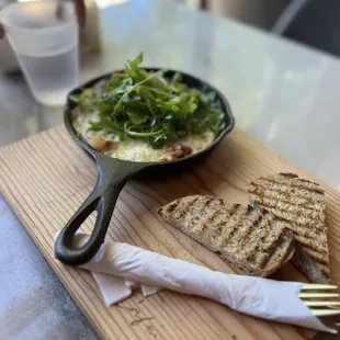 a plate of food on a cutting board