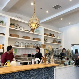 a couple of people sitting at a counter